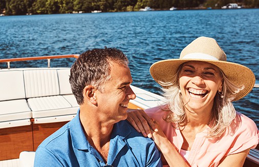 Senior couple laughing on boat