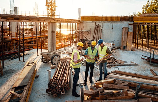 Three workers at construction site