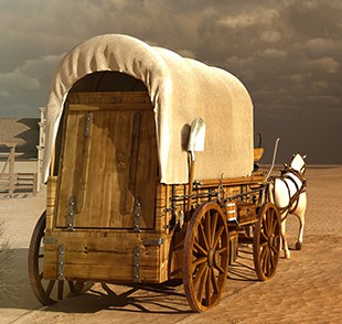 Desert landscape with old wagon being pulled by horse
